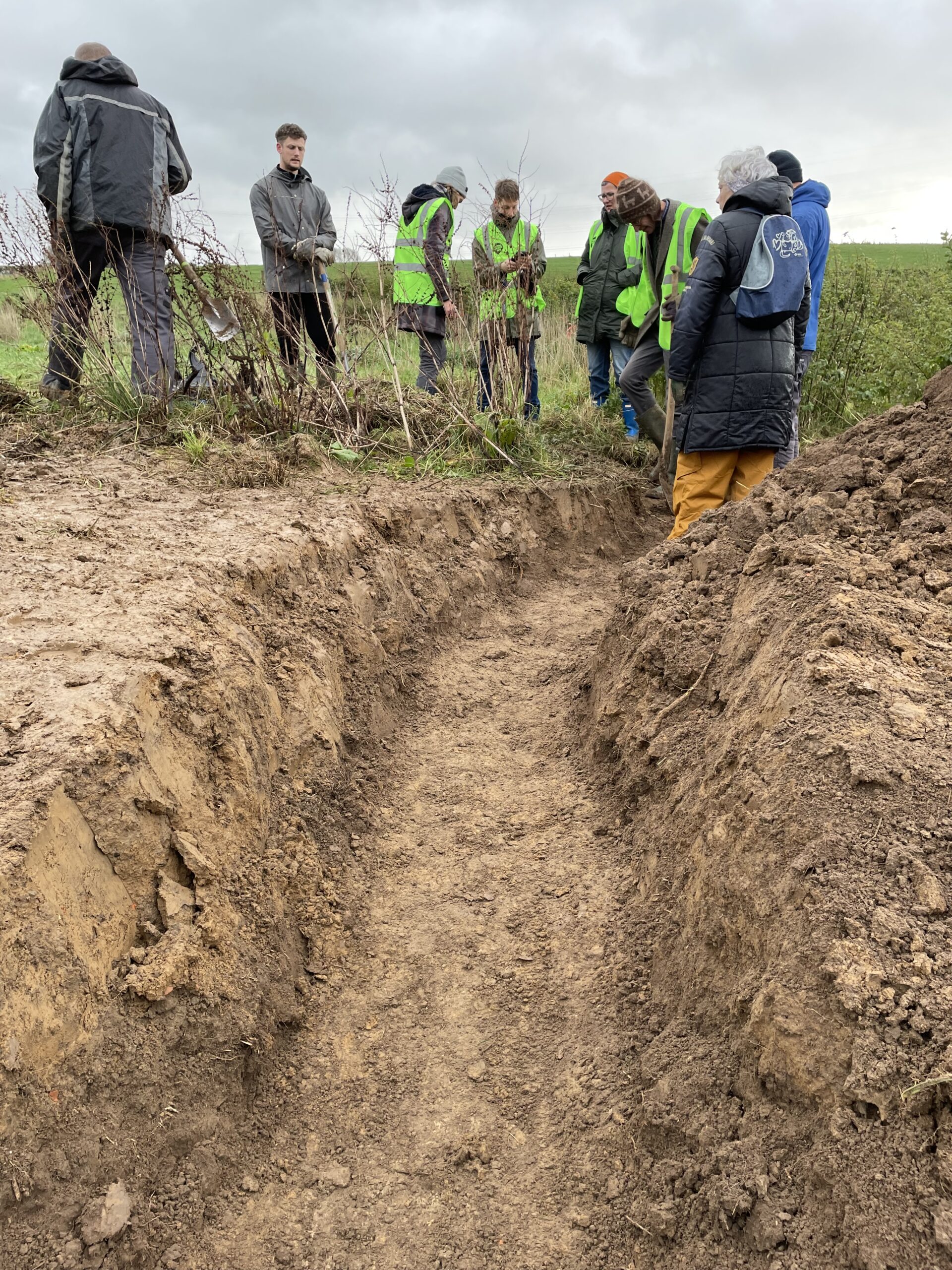 Digging a trench to catch rainwater